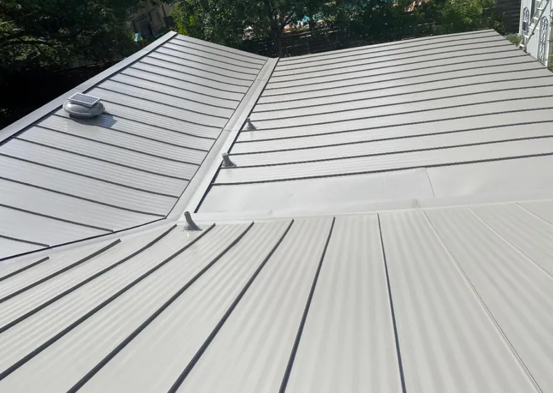 Solar attic fan installed on a metal roof for Roof Ventilation in Williamsburg